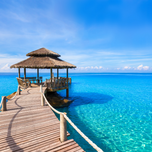 View on a pier in the Maldives looking to the Indian Ocean