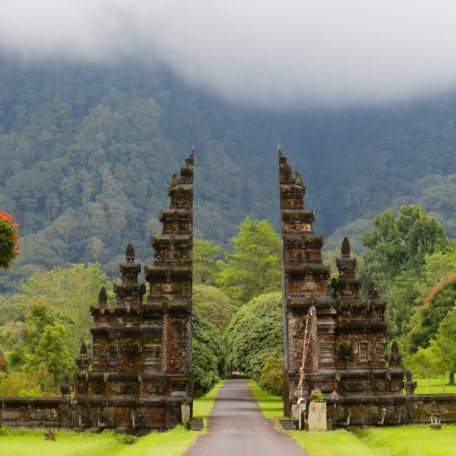 The view of a Bali temple amongst the jungle background